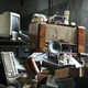 A heap of old computer, radio, and phone technology.